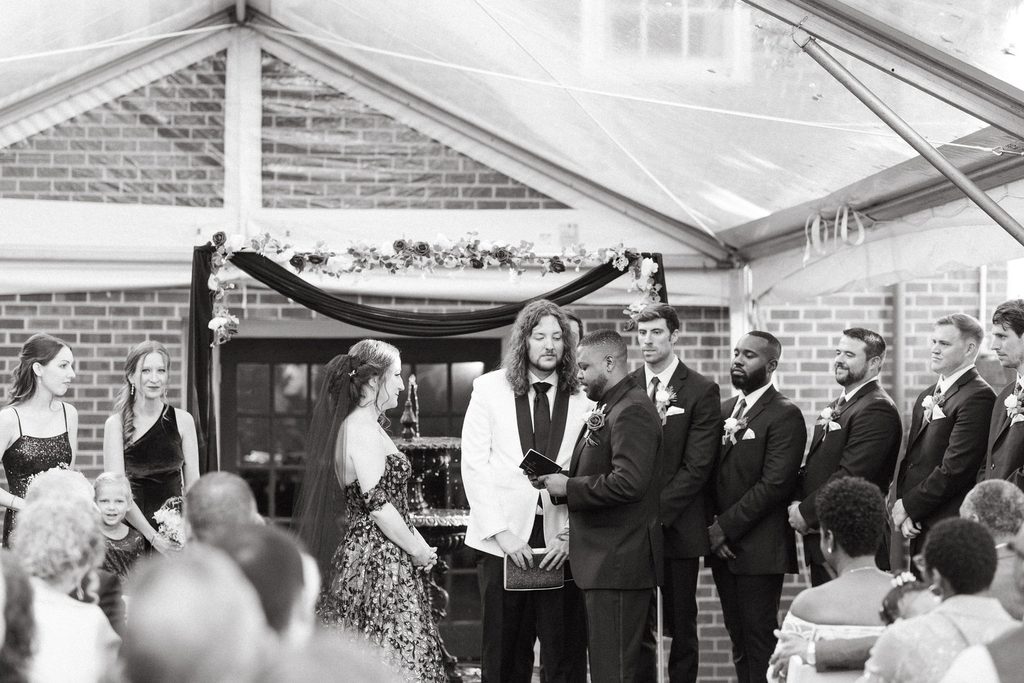 Wide view of Alissa and CJ's wedding ceremony with their guests