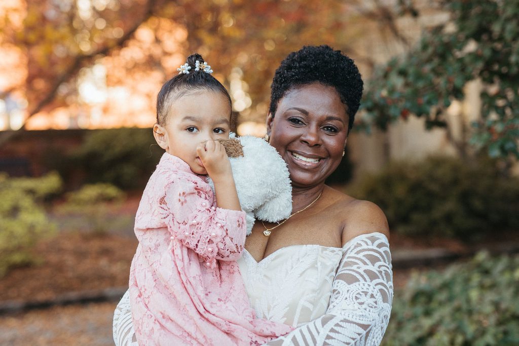 Alissa and CJ with family on their wedding day