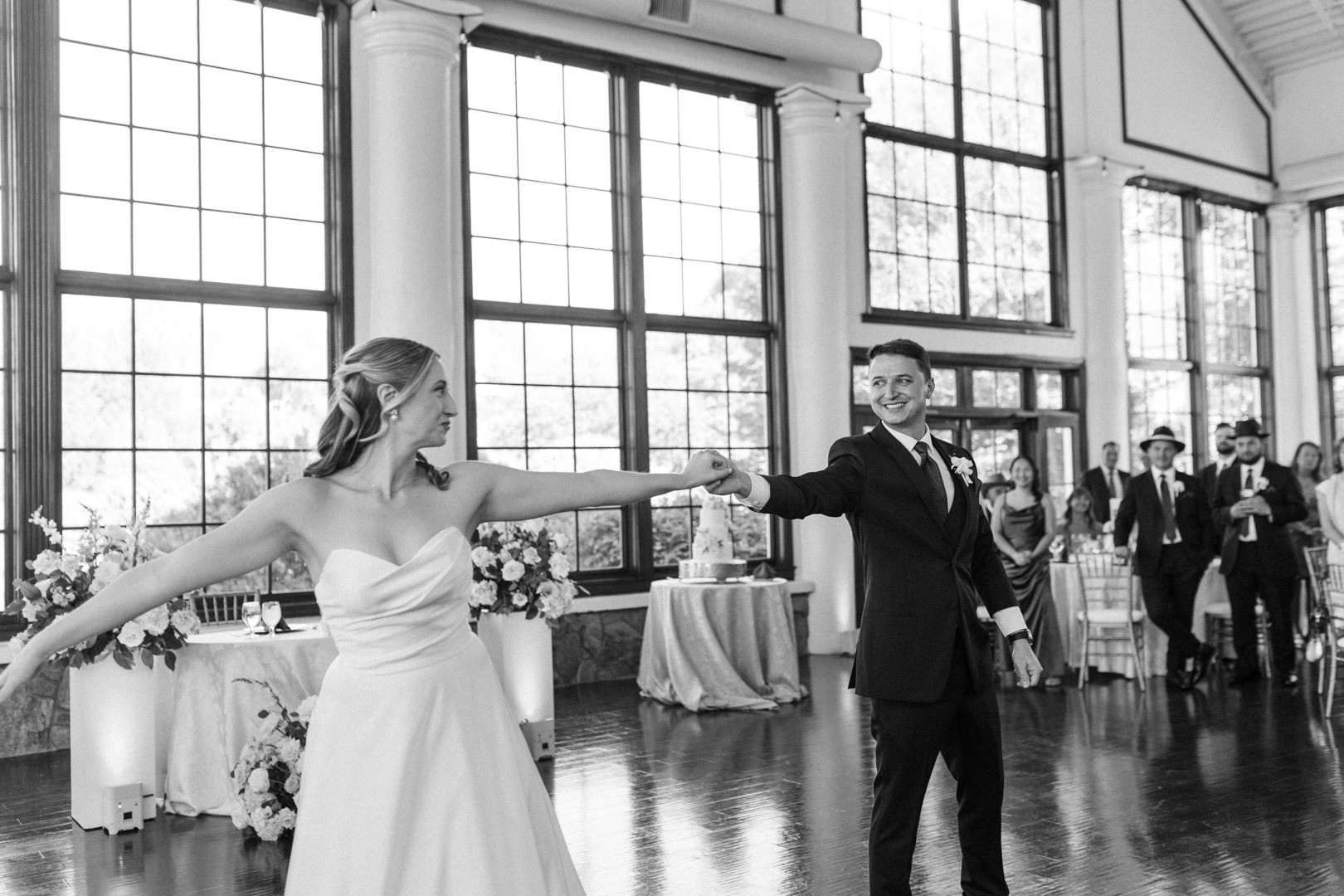 Black and white photo of the couple dancing at their reception