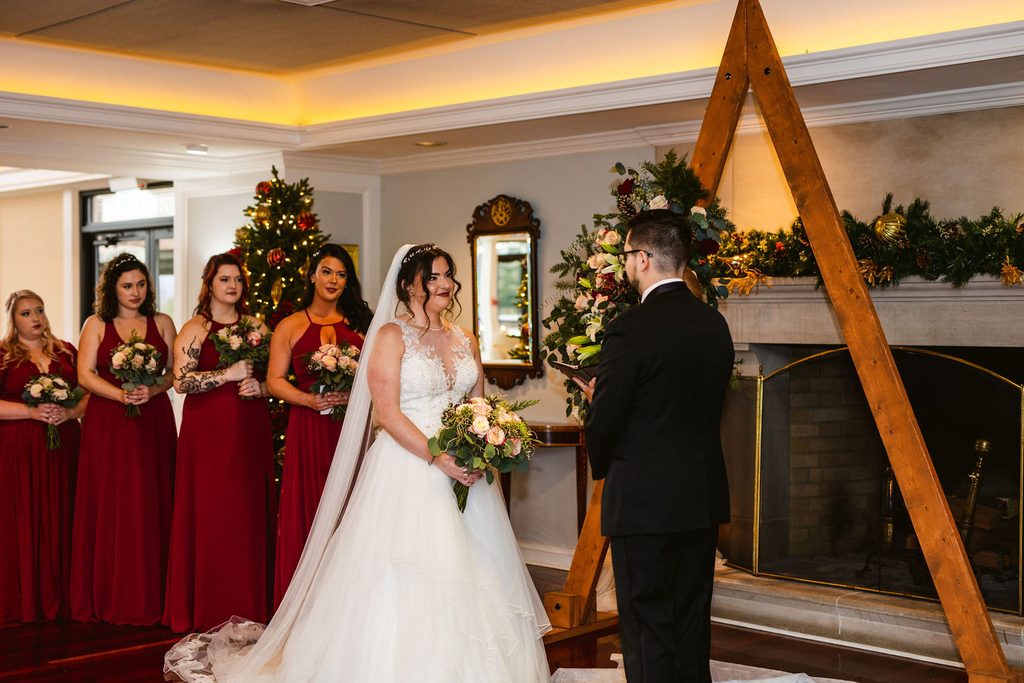 Mel and Josh at the altar during their wedding ceremony