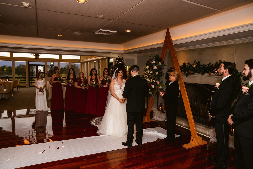Wide view of Mel and Josh's wedding ceremony with their guests