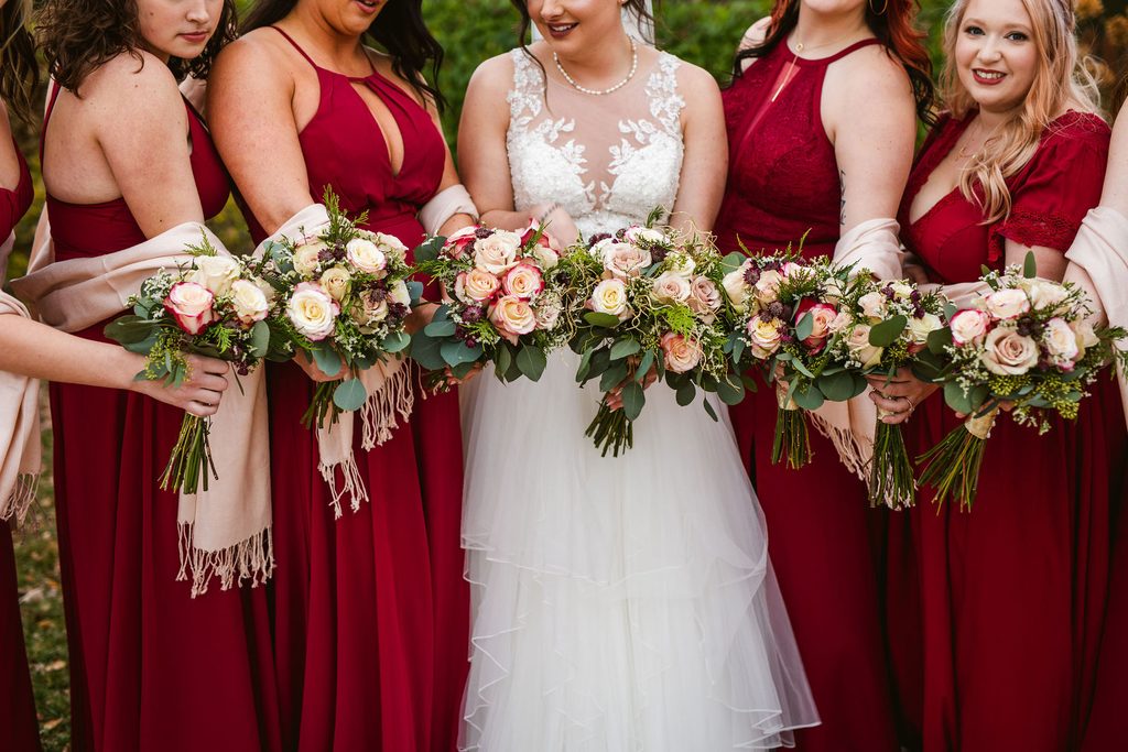 Mel and Josh with family on their wedding day