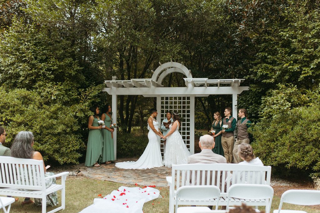 Morgan and Erin at the altar during their wedding ceremony