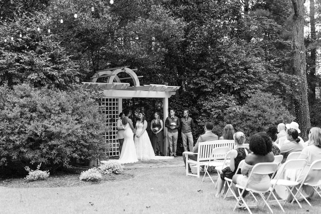 Wide view of Morgan and Erin's wedding ceremony with their guests