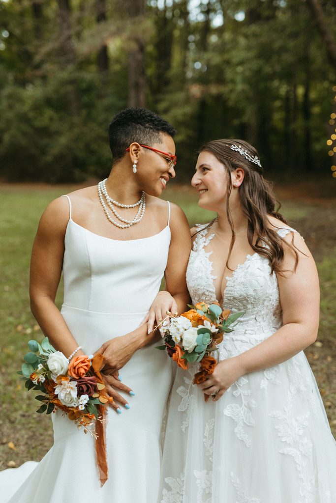 Morgan and Erin sharing a kiss during their couple portraits